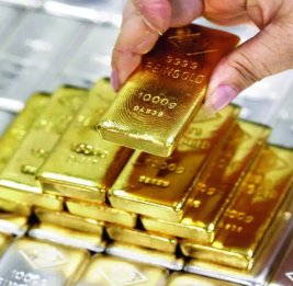 На мировом рынке цены на золото и серебро снизились